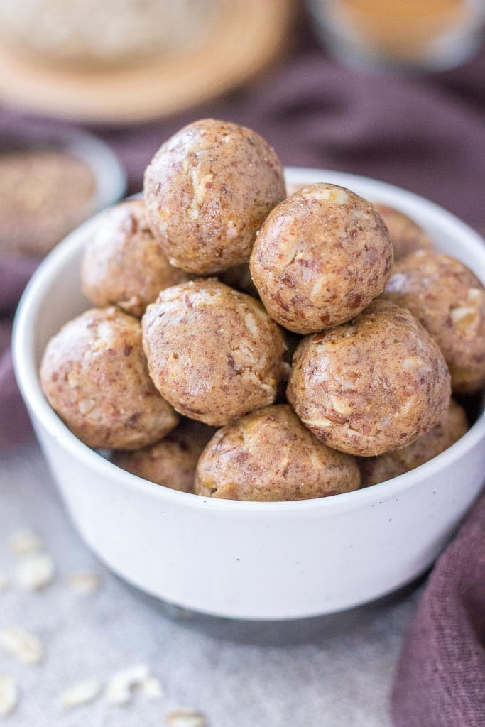 No Bake Peanut Butter Protein Balls with oats, peanut butter, and flax seeds served in a bowl