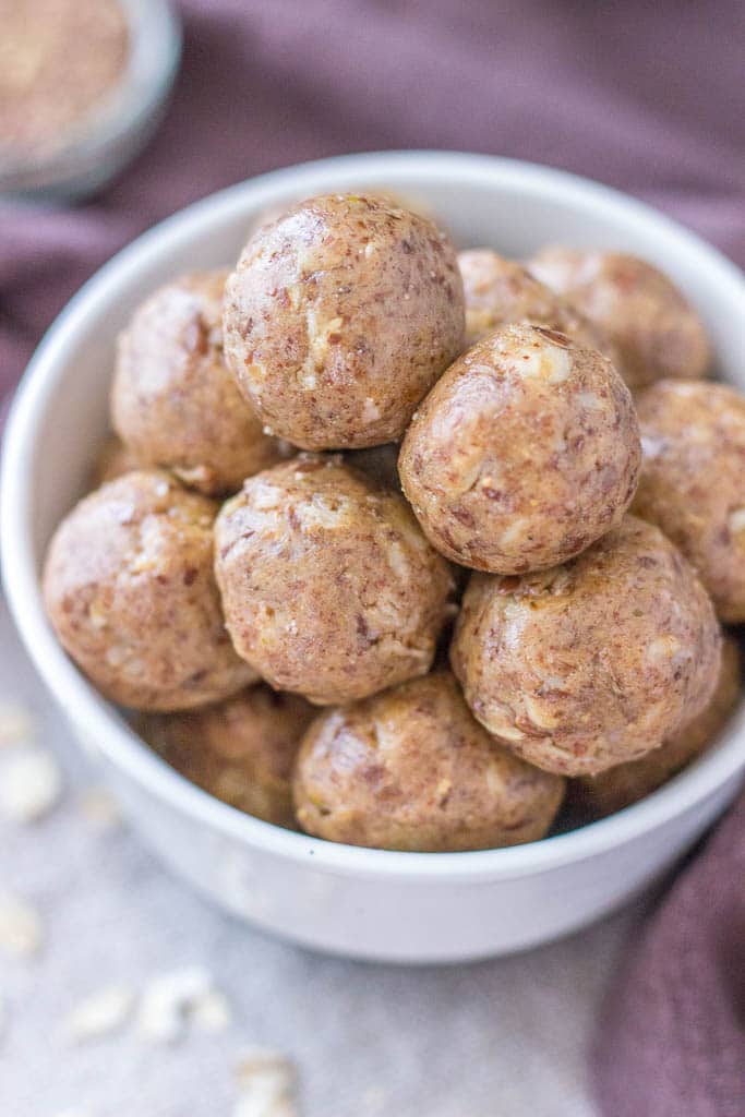 No Bake Peanut Butter Protein Balls with oats, peanut butter, and flax seeds served in a bowl