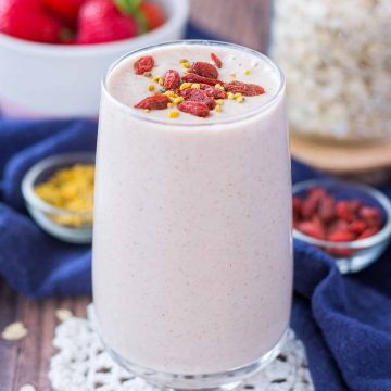 Strawberry Oatmeal Smoothie served in a glass topped with goji berries