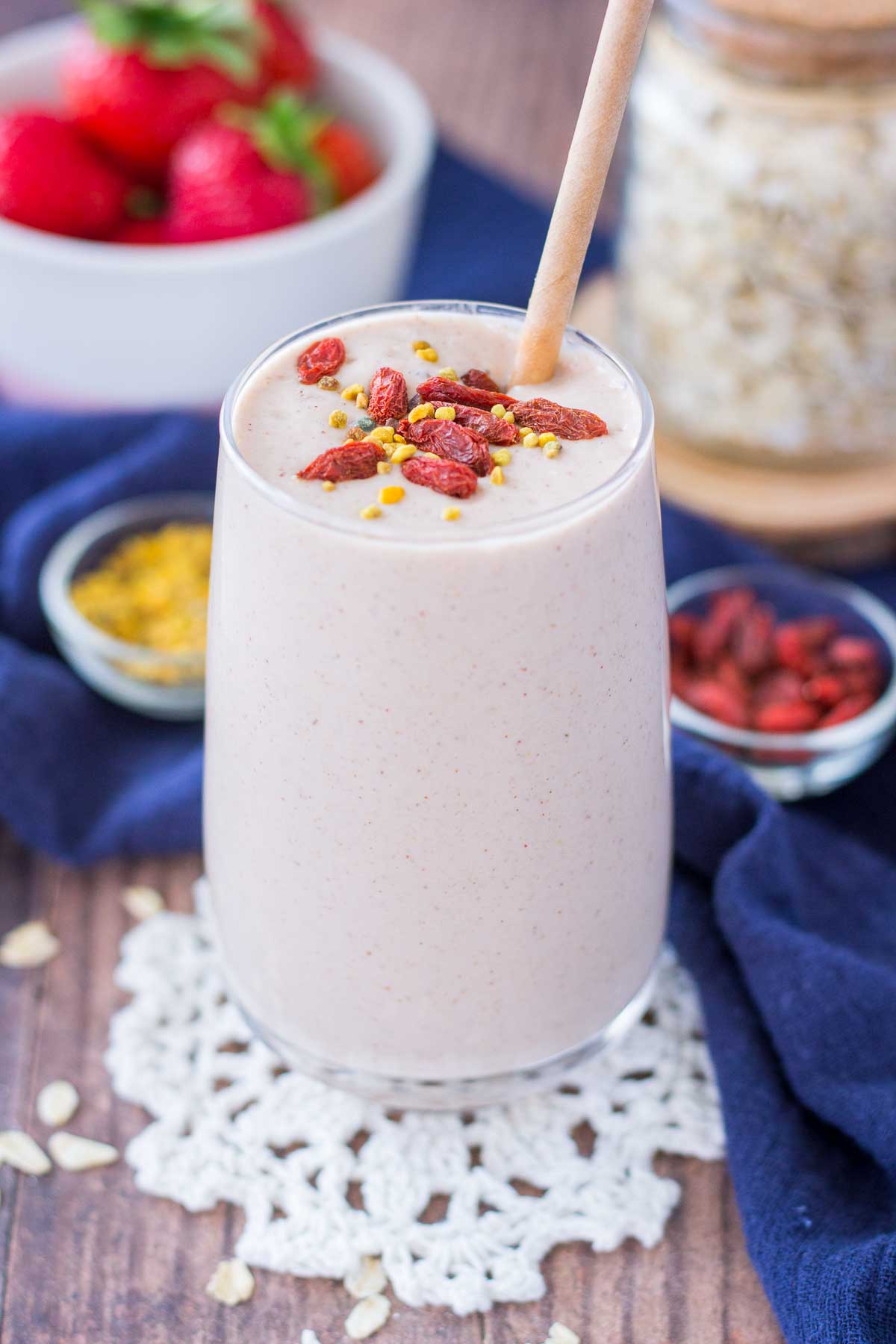 Strawberry Oatmeal Smoothie served in a glass with a straw