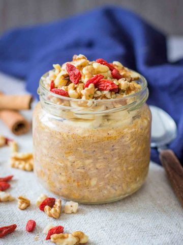 Pumpkin Overnight Oats topped with walnuts and goji berries