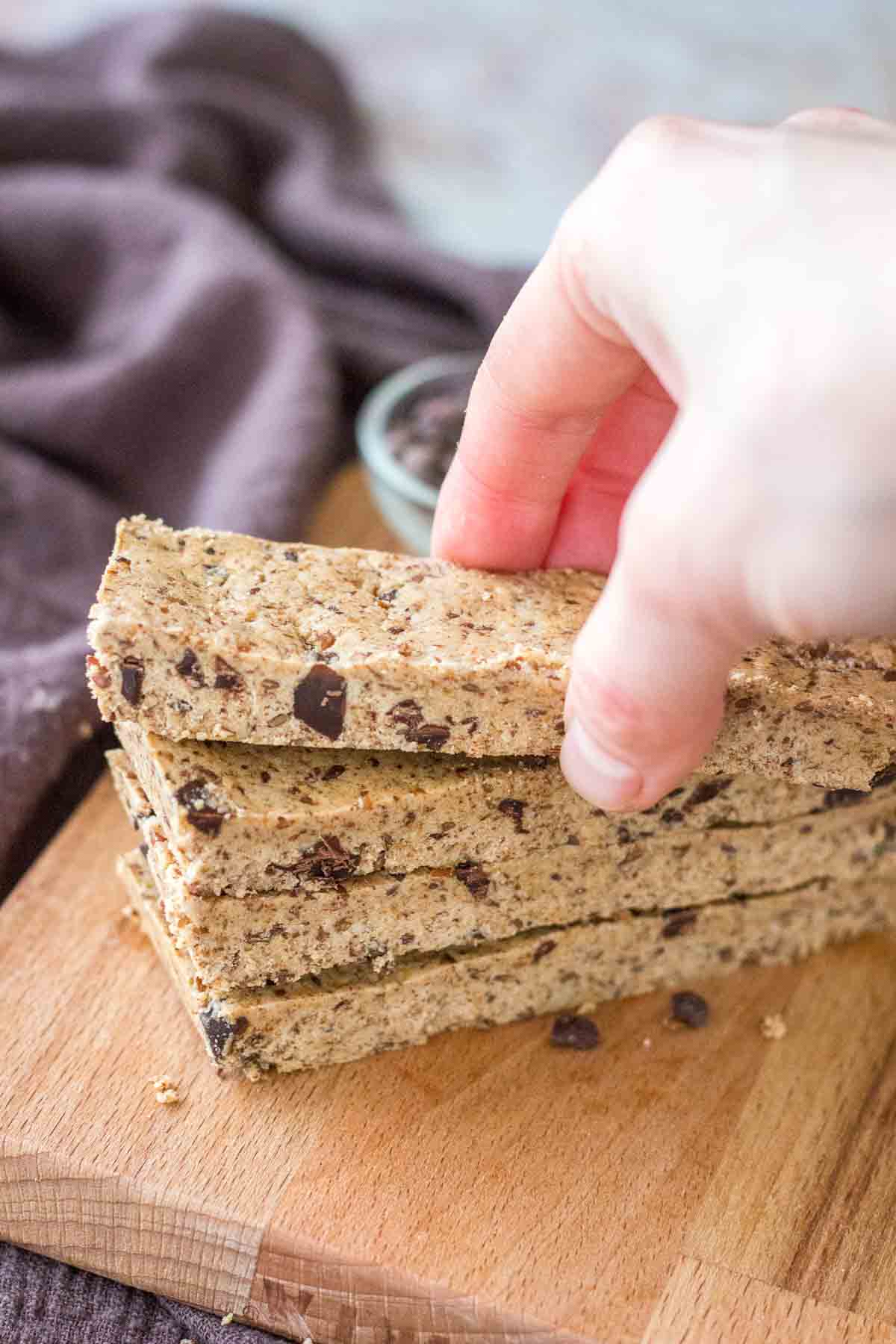 Hand taking Cookie Dough Protein Bars