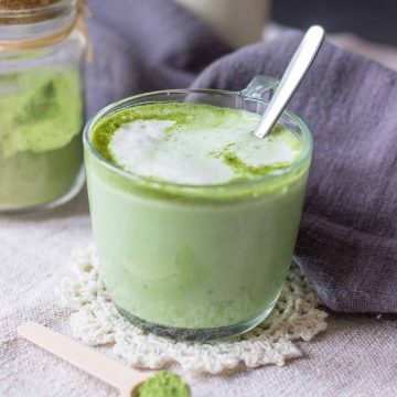 Matcha latte served in a mug with a spoon