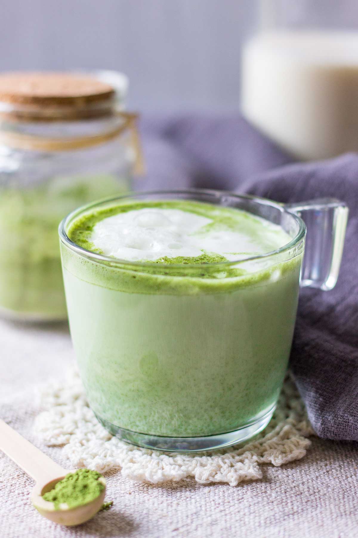 Matcha latte served in a mug with frothed milk