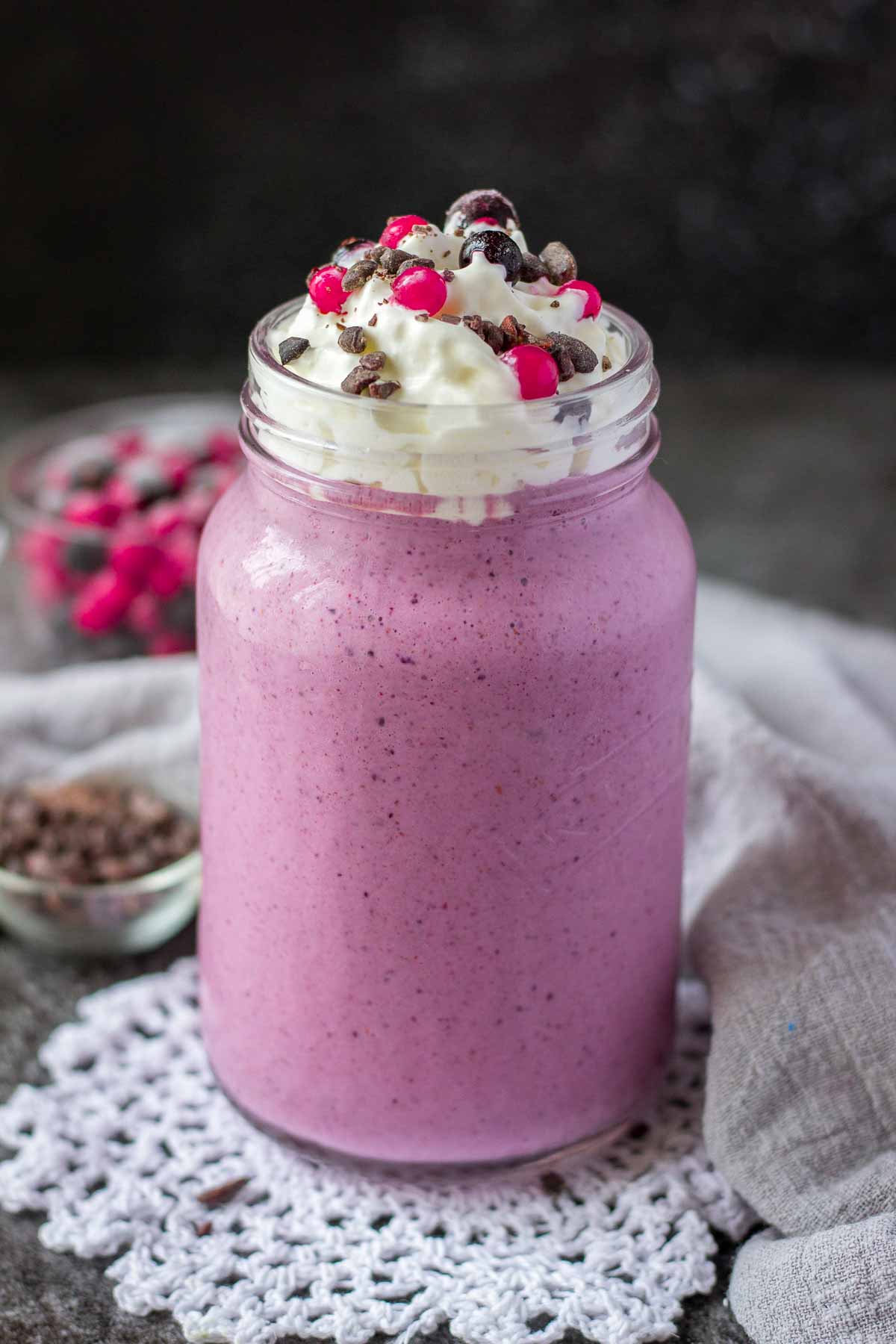Berry Smoothie topped with cream served in a glass