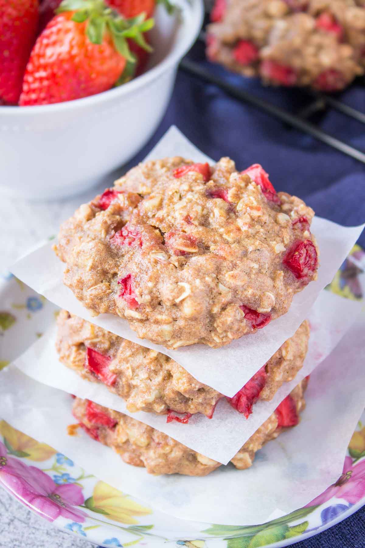 Oatmeal cookies with fresh strawberries placed on a plate