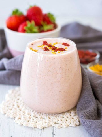 Strawberry Peanut Butter Smoothie served in a glass topped with goji berries