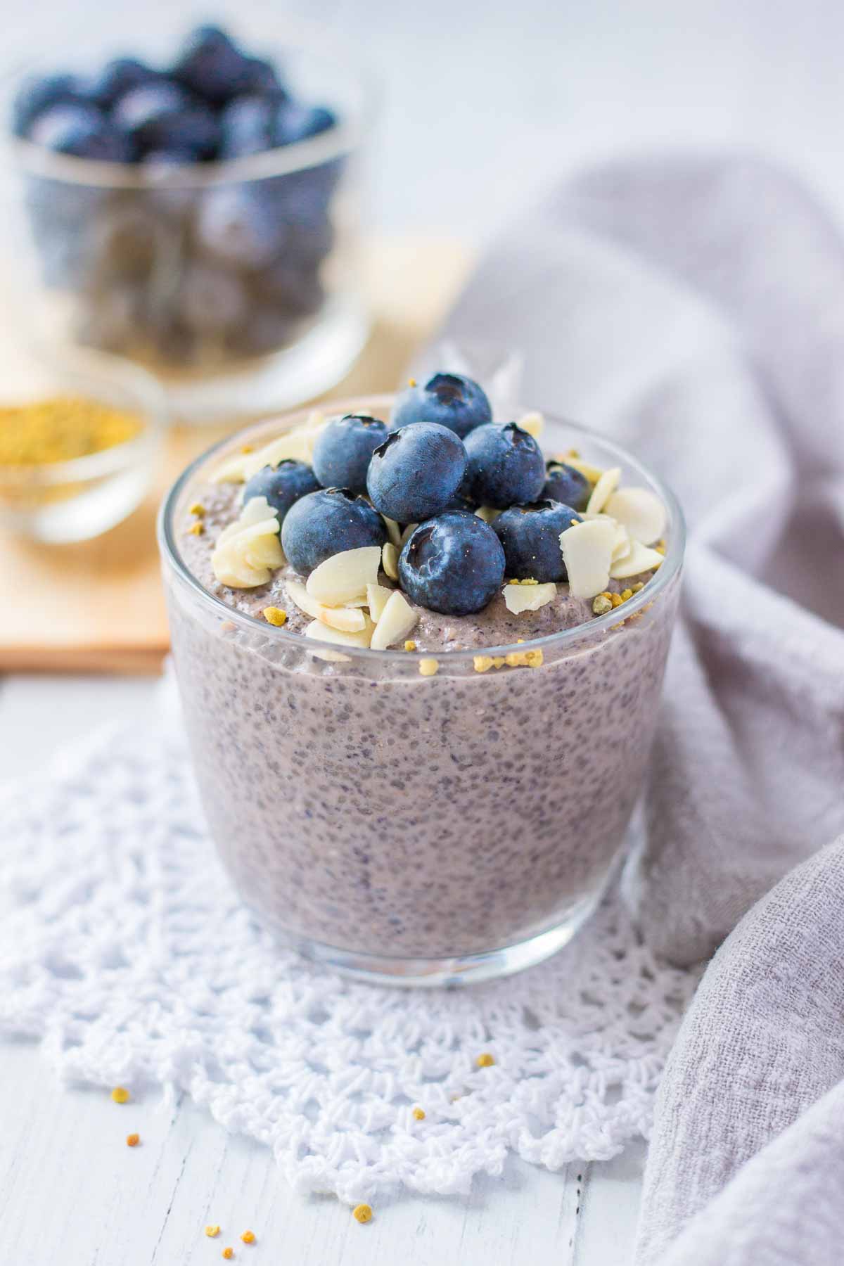 Blueberry Chia Pudding served in a glass bowl topped with fresh blueberries and almonds