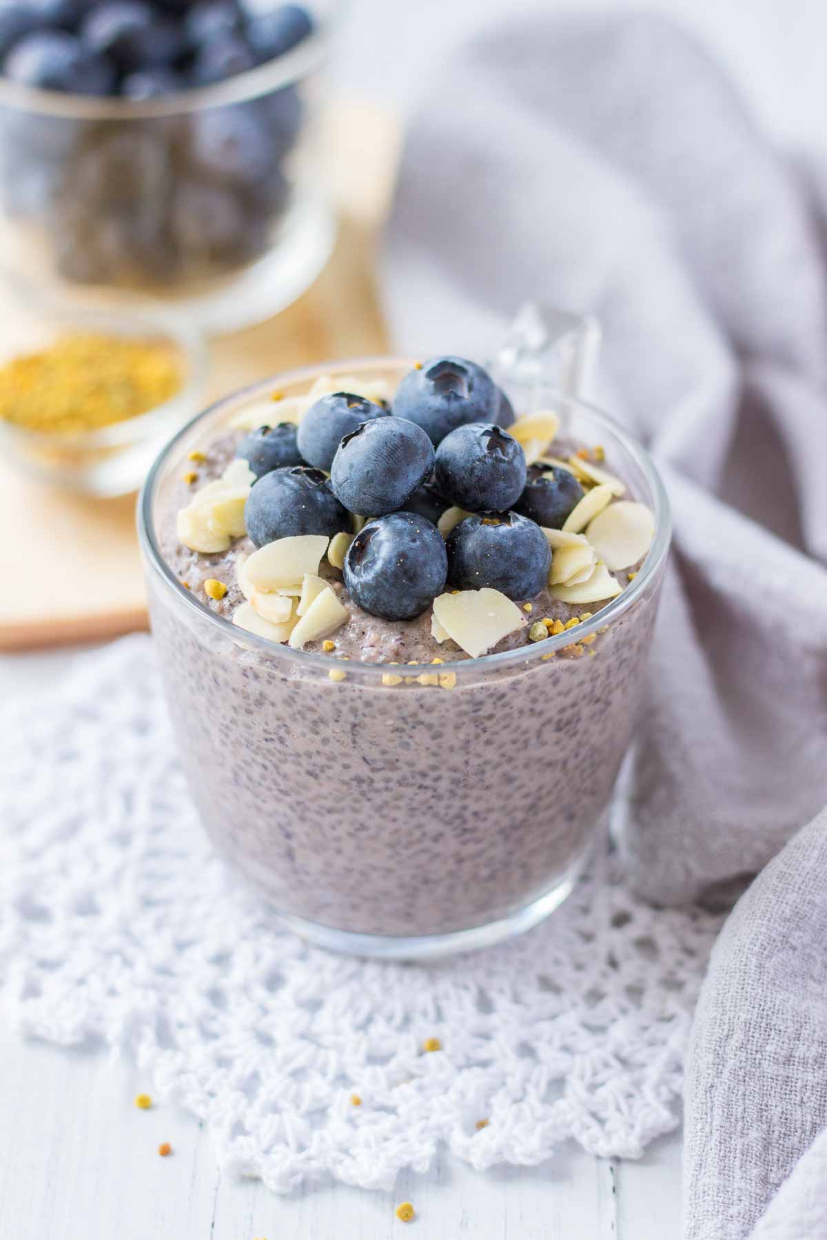 Blueberry Chia Pudding served in a glass bowl topped with fresh blueberries and almonds