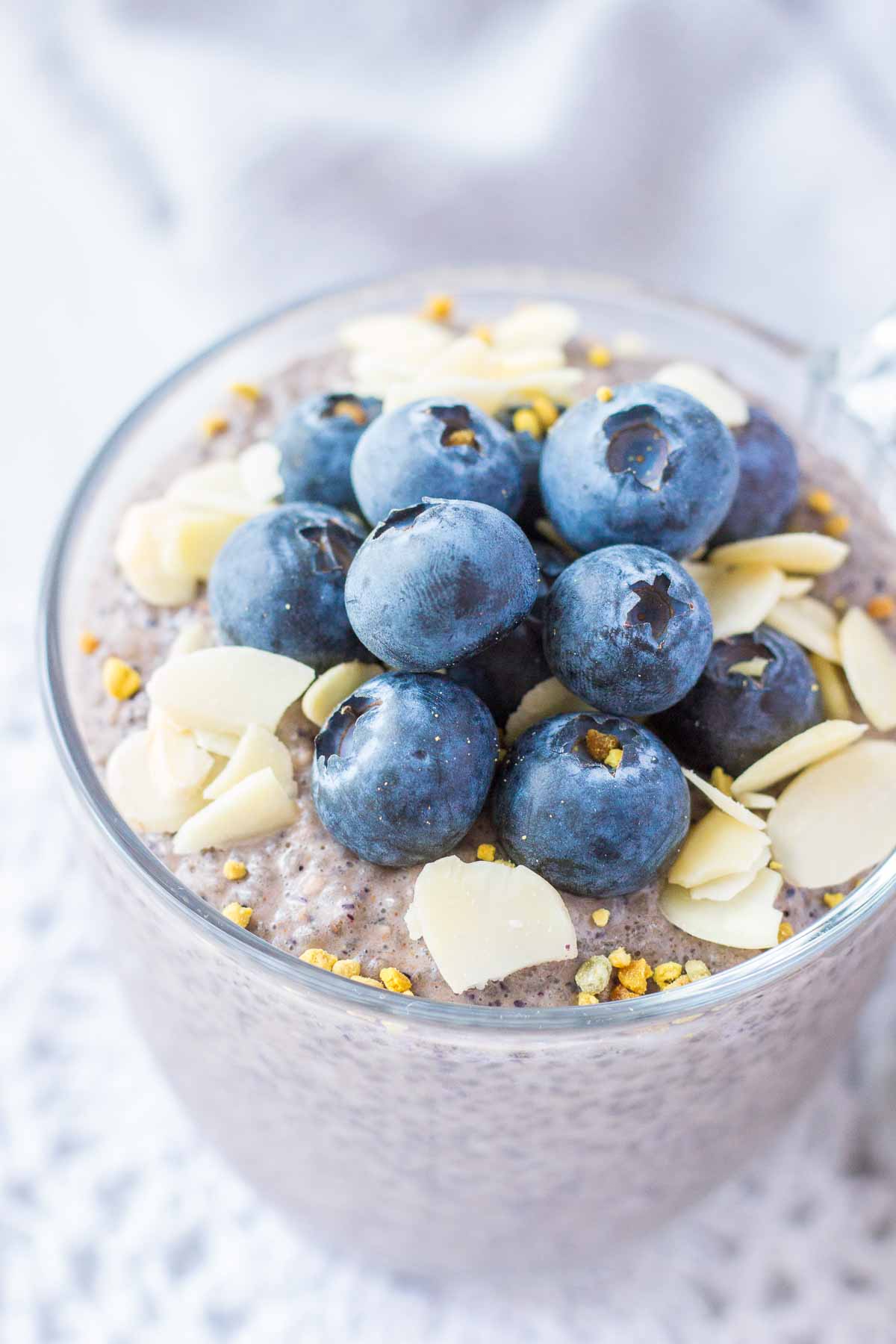 Close up of Blueberry Chia Pudding topped with fresh blueberries and almonds