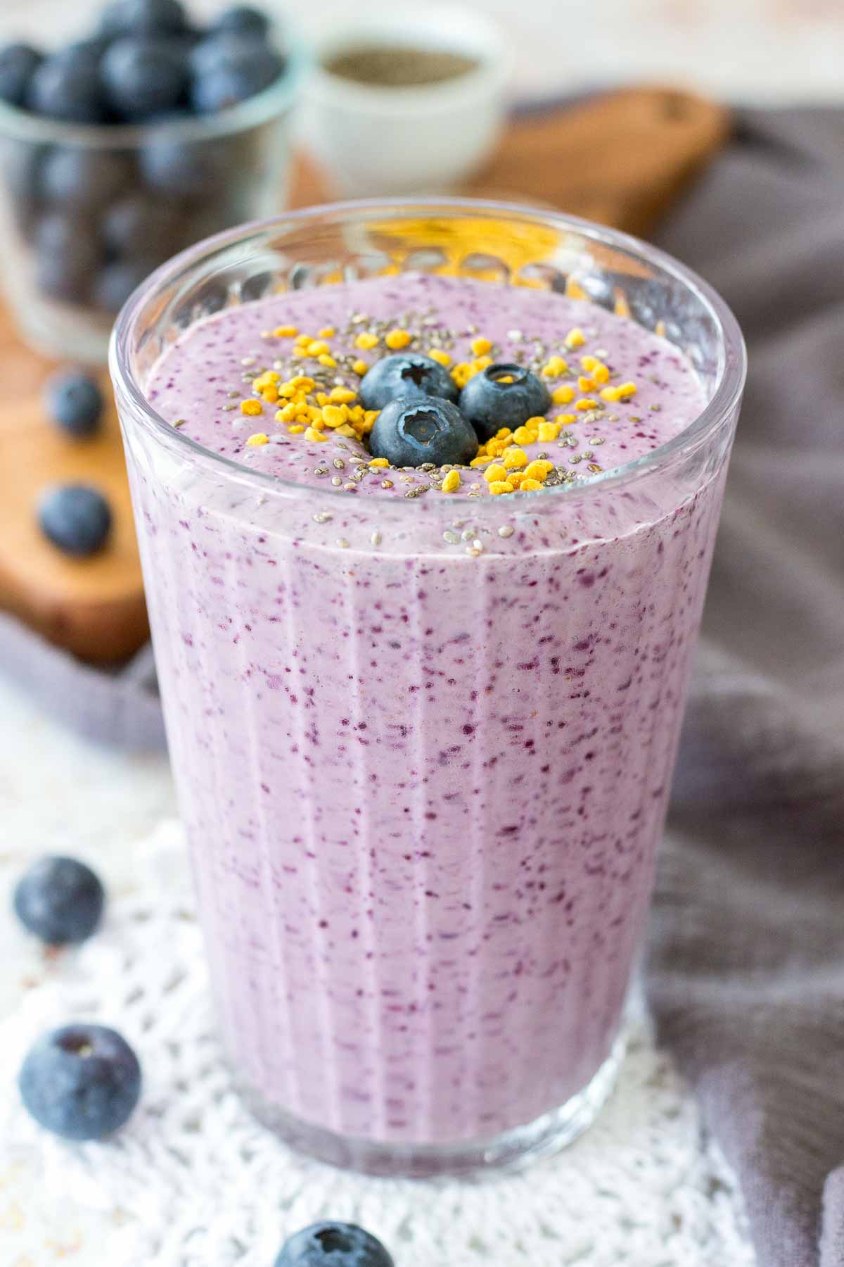 Blueberry Chia Smoothie in a glass with fresh blueberries on top