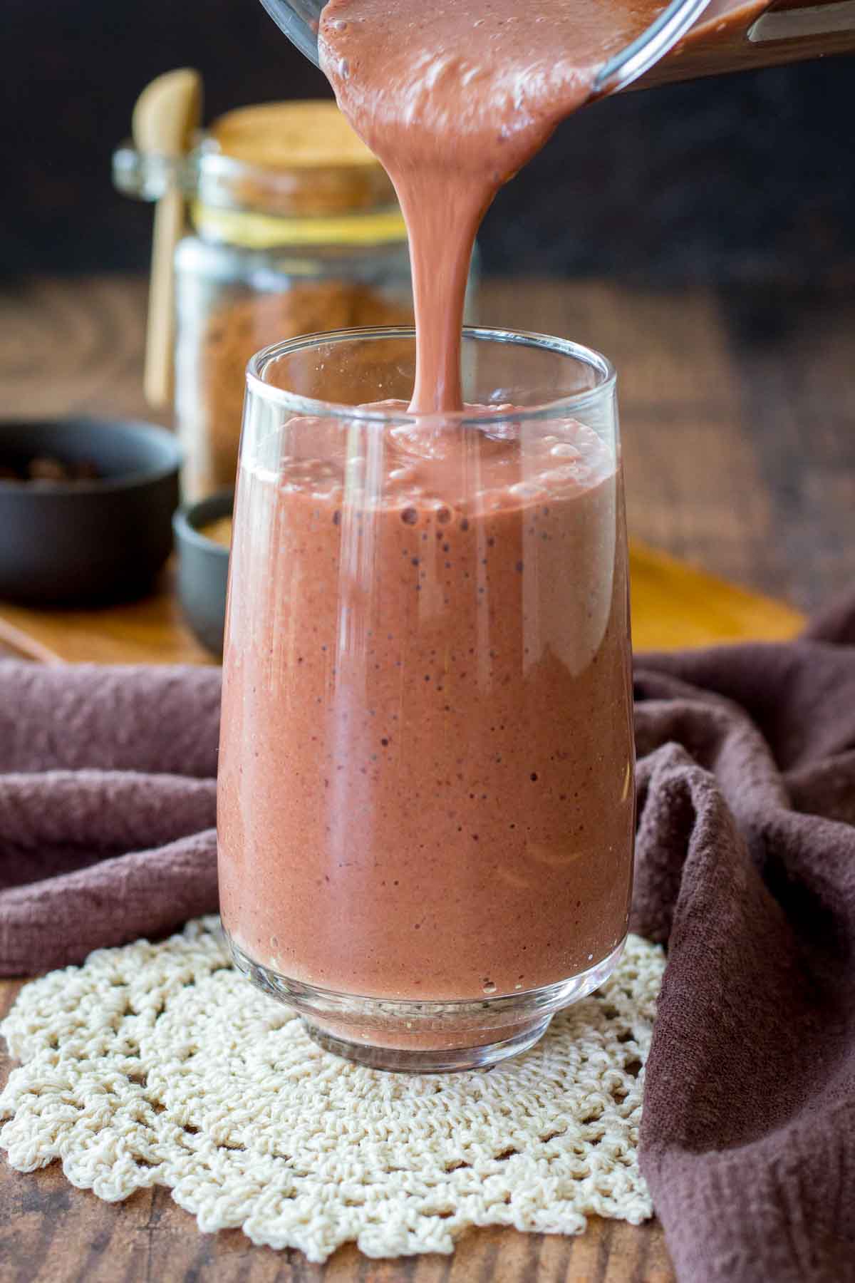 Pouring Cherry Chocolate Smoothie in a glass