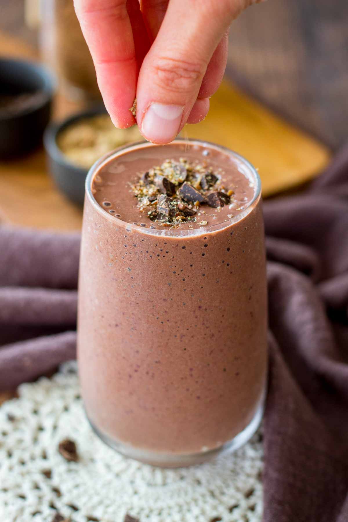 Cherry Chocolate Smoothie served in a glass topped with dark chocolate