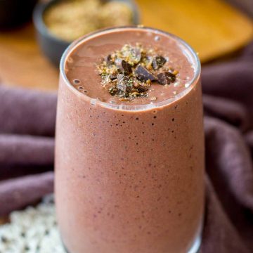 Cherry Chocolate Smoothie served in a glass topped with dark chocolate