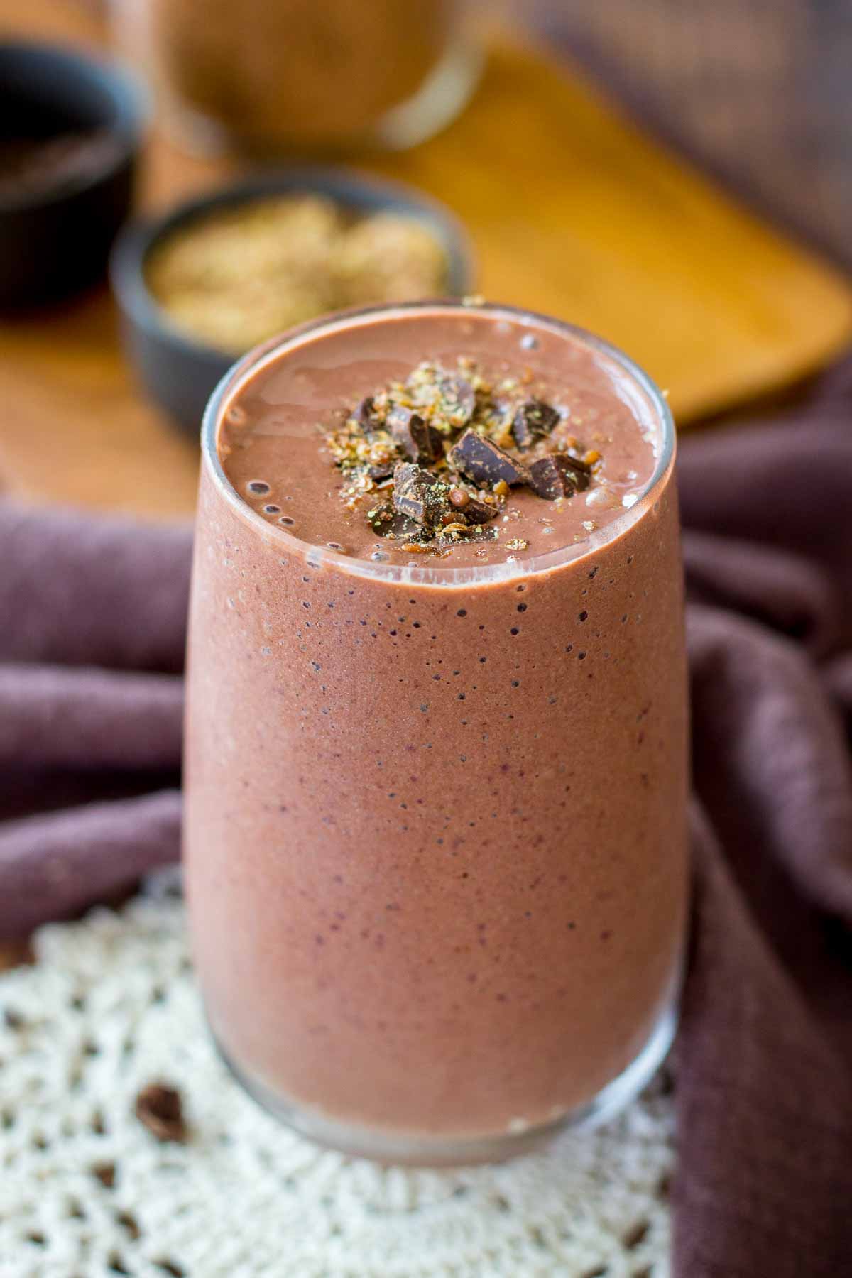 Cherry Chocolate Smoothie served in a glass topped with dark chocolate