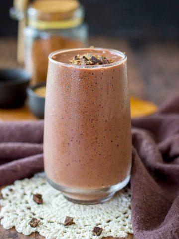 Cherry Chocolate Smoothie served in a glass topped with dark chocolate