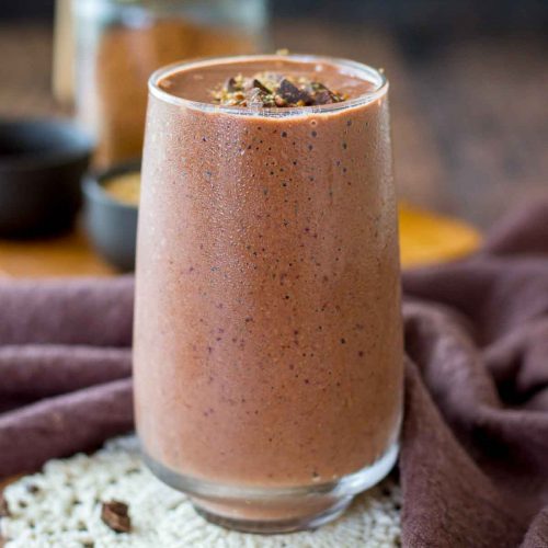 Cherry Chocolate Smoothie served in a glass topped with dark chocolate