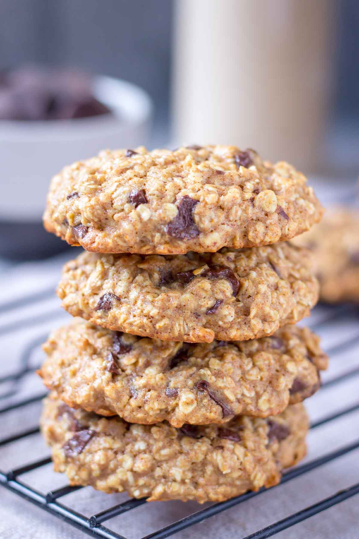 Chocolate Chip Oatmeal Cookies stacked on a cooling tray