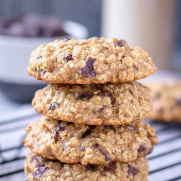 Chocolate Chip Oatmeal Cookies stacked on a cooling tray