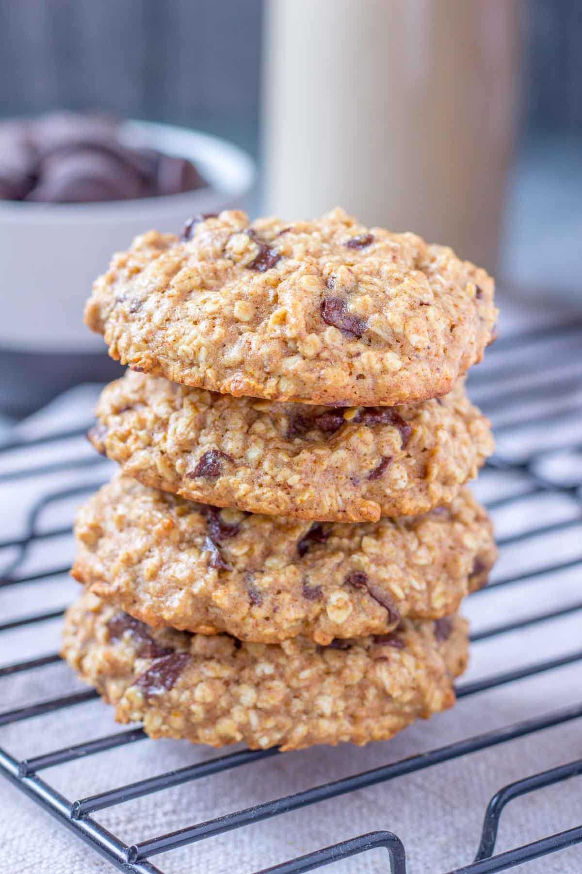 Chocolate Chip Oatmeal Cookies stacked on a cooling tray