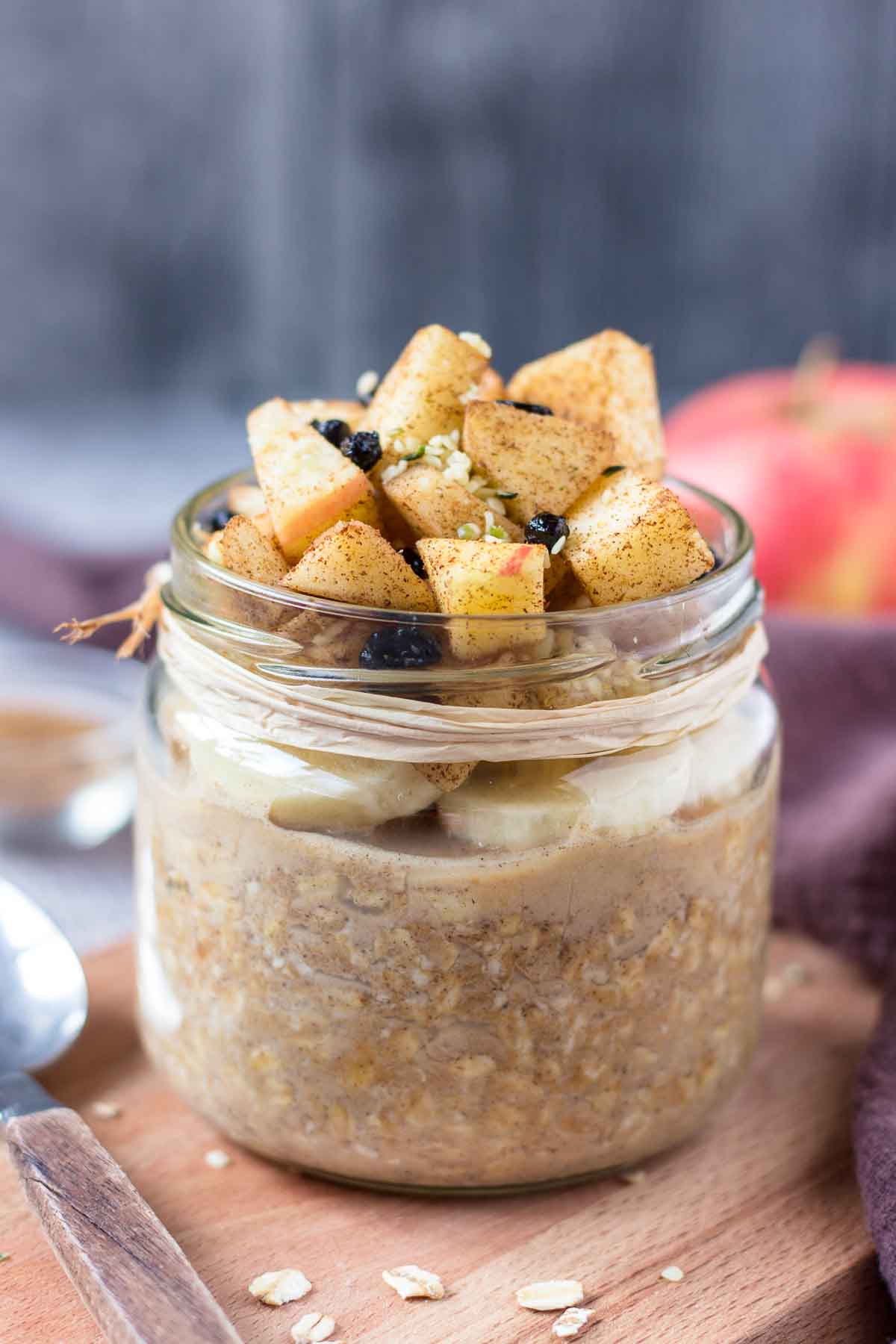 Apple Cinnamon Overnight Oats topped with banana slices and fresh diced apple