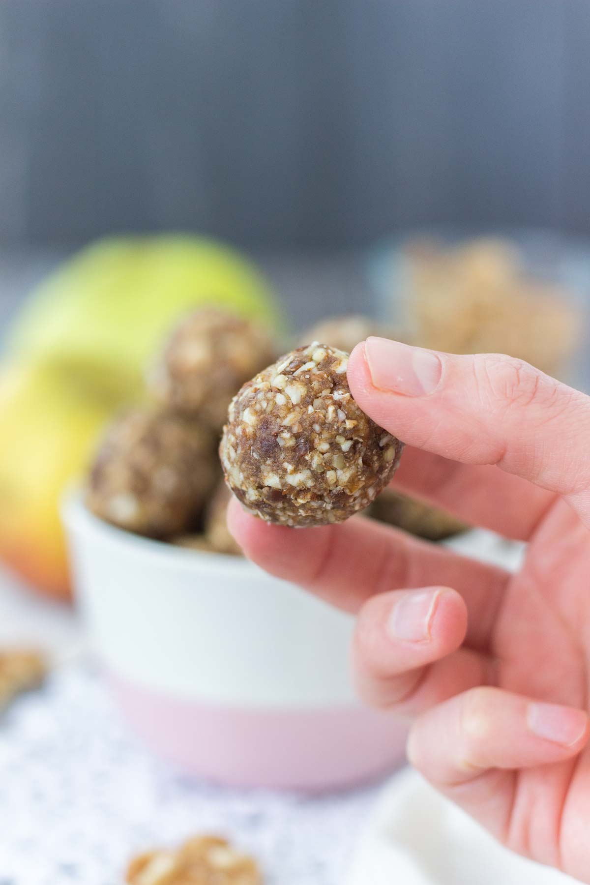 Hand holding Apple Pie Energy Bites