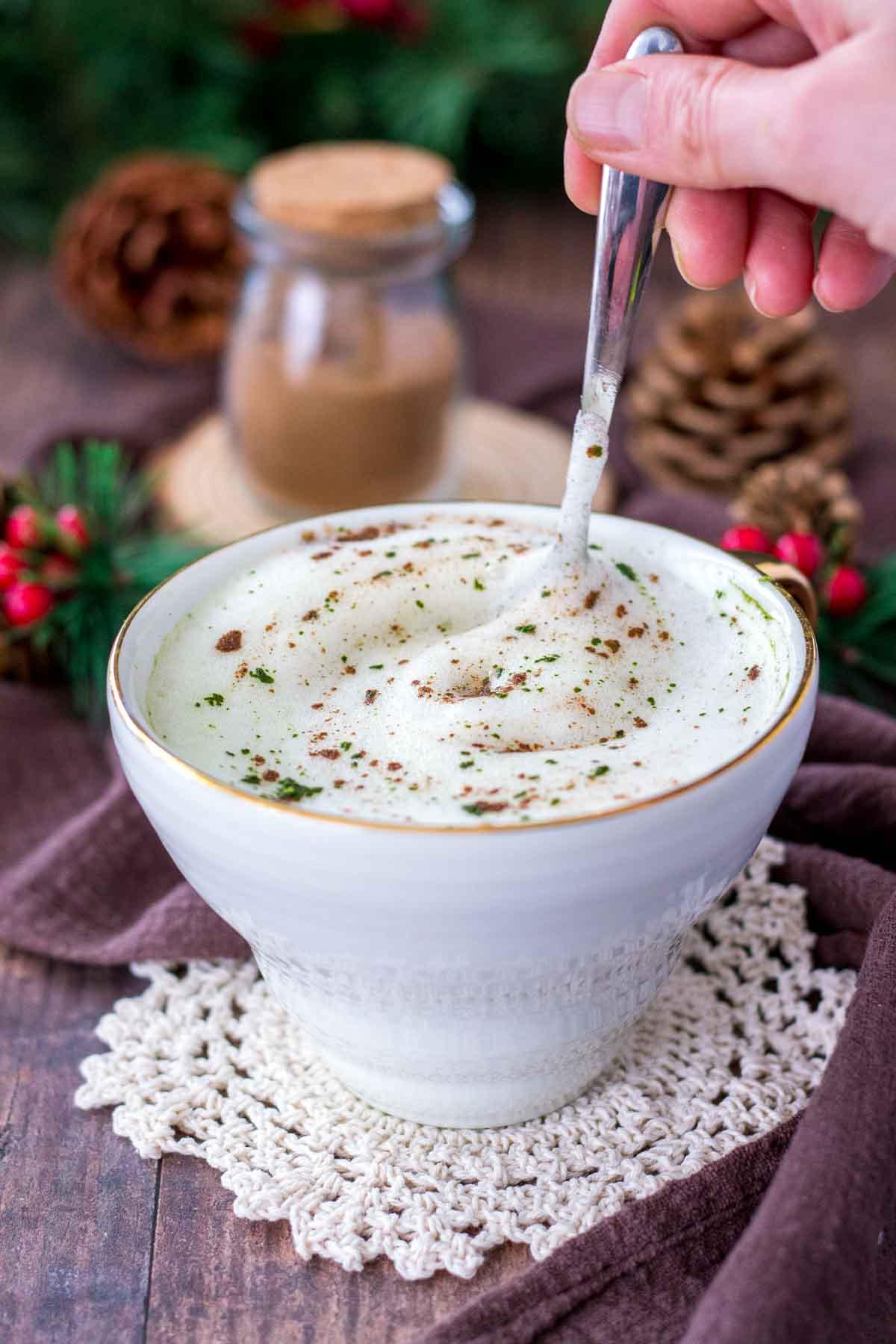 Gingerbread Matcha Latte served in a white cup