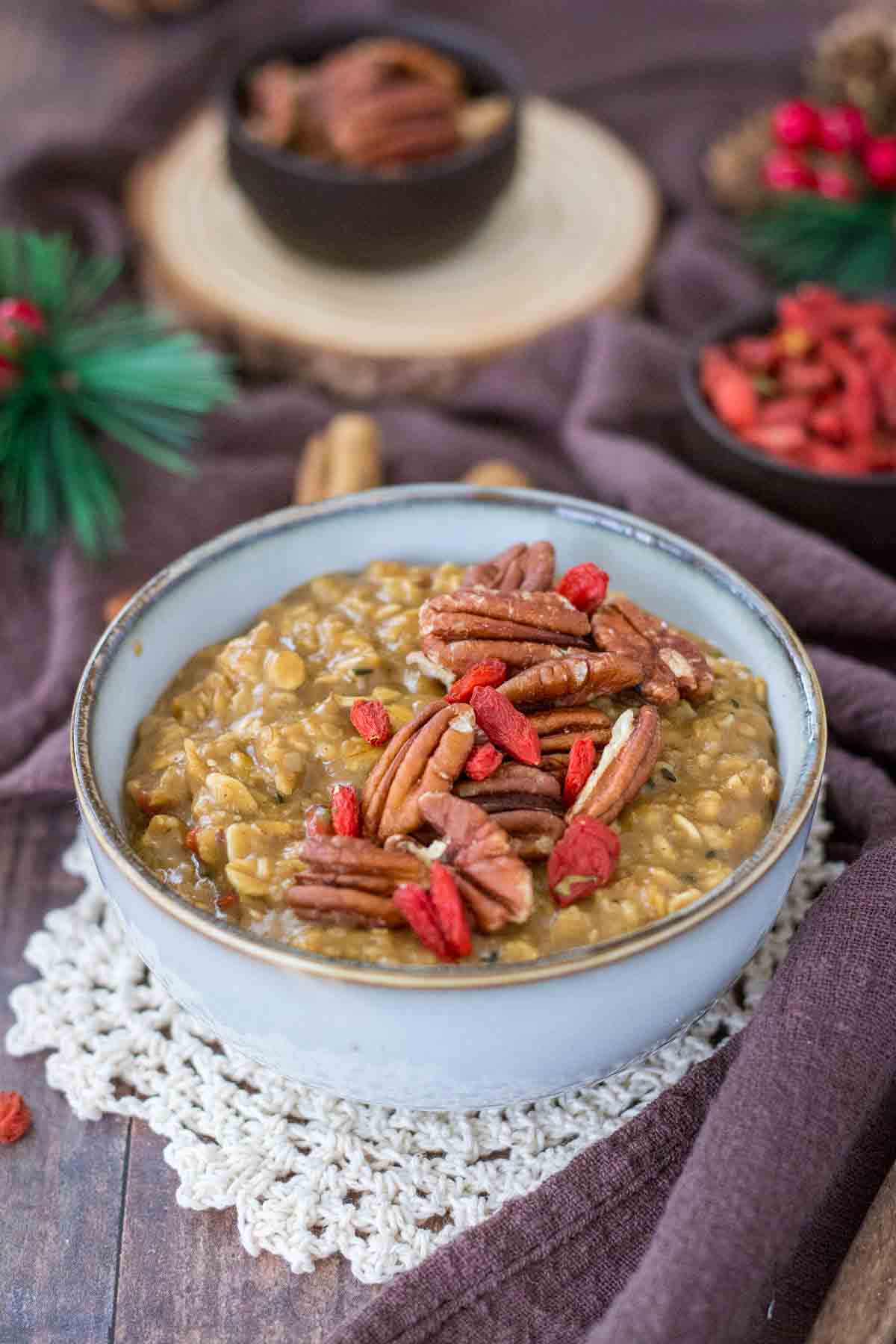 Gingerbread Oatmeal with goji berries topped with pecans