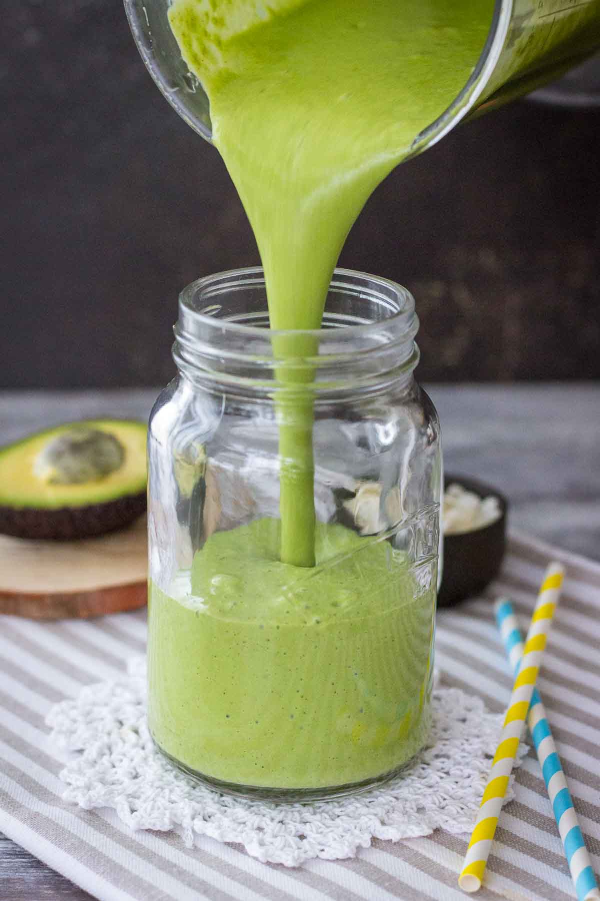 Pouring Matcha Protein Shake into glass