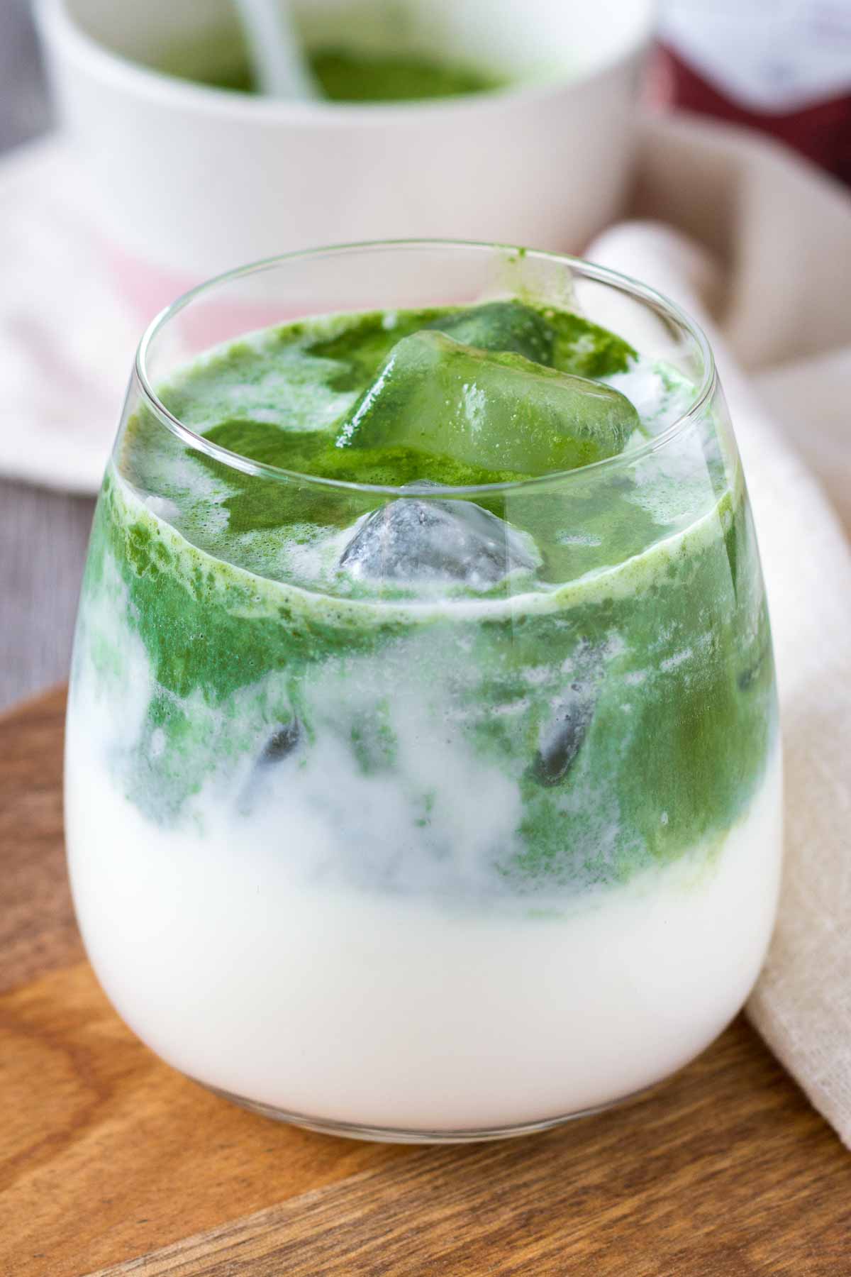 Iced Coconut Matcha Latte in a glass with ice