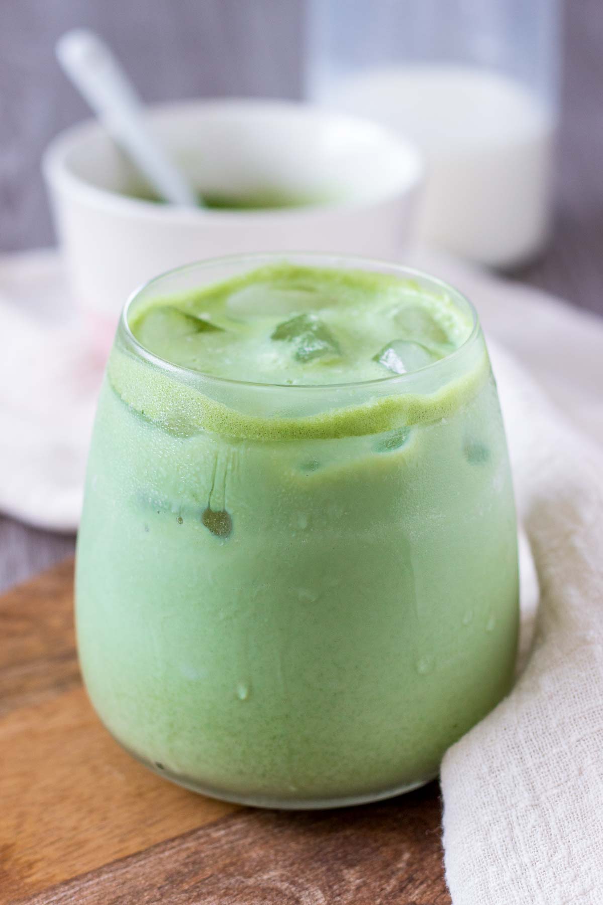Iced Coconut Matcha Latte in a glass with ice