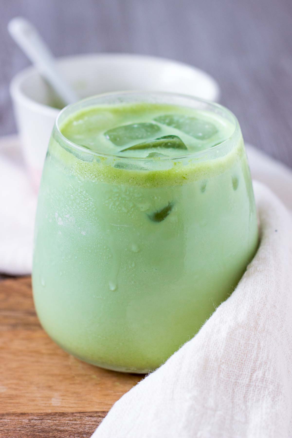 Iced Coconut Matcha Latte in a glass with ice