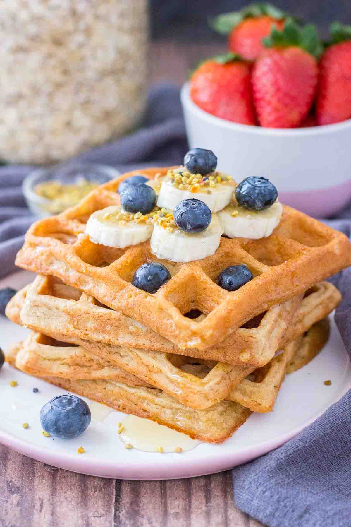 Oatmeal Waffles topped with banana and blueberries