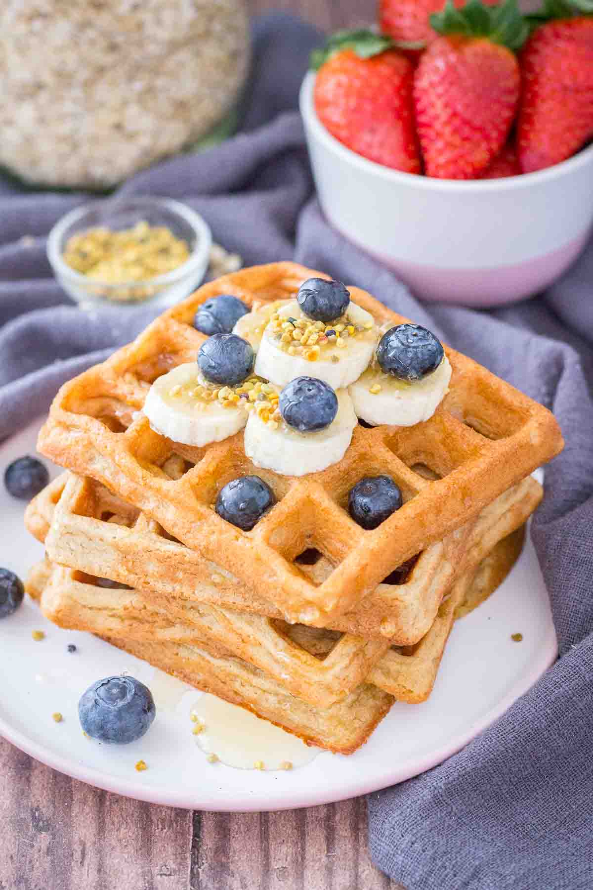Oatmeal Waffles topped with banana slices and blueberries