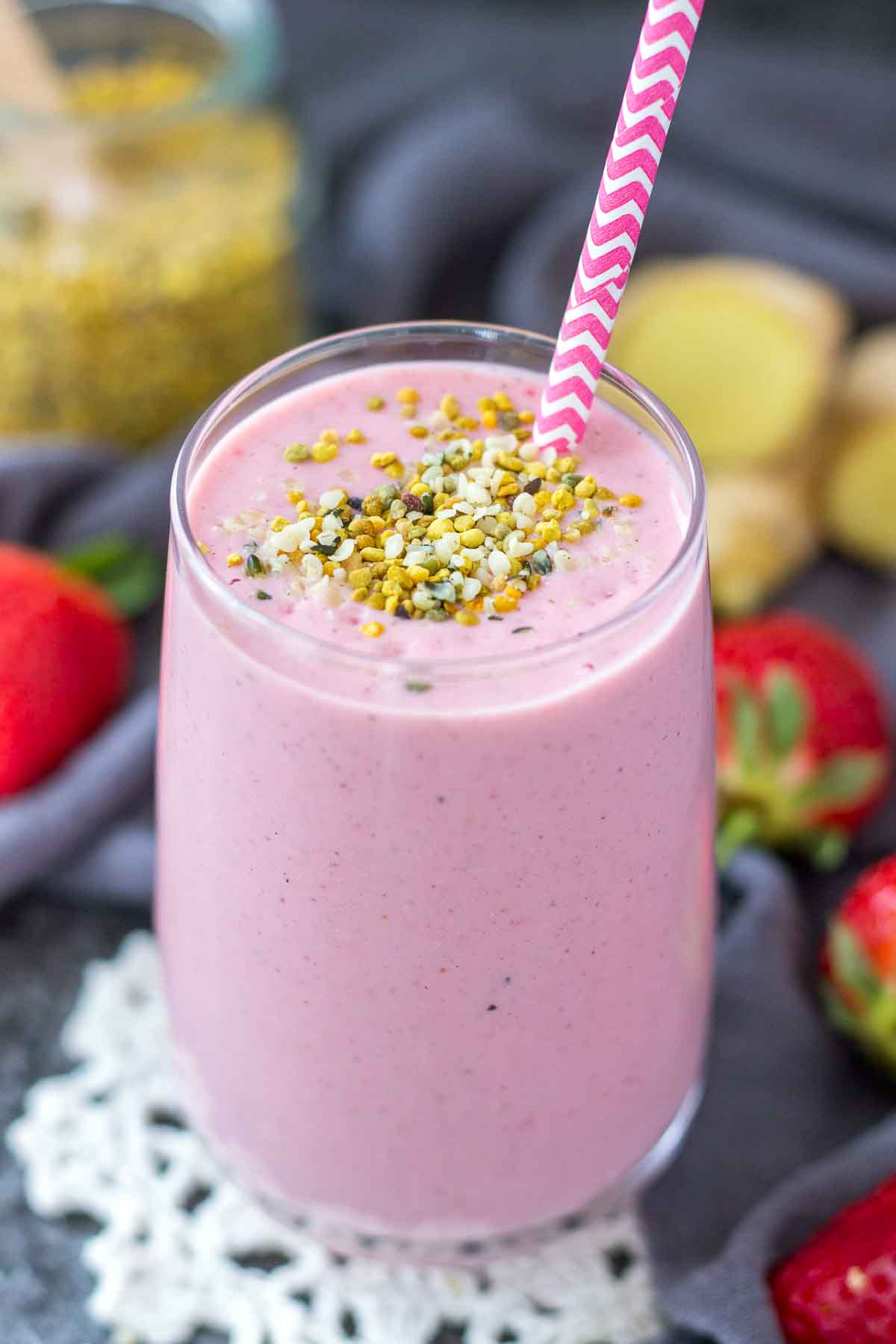 Strawberry Ginger Smoothie served in a glass with a straw
