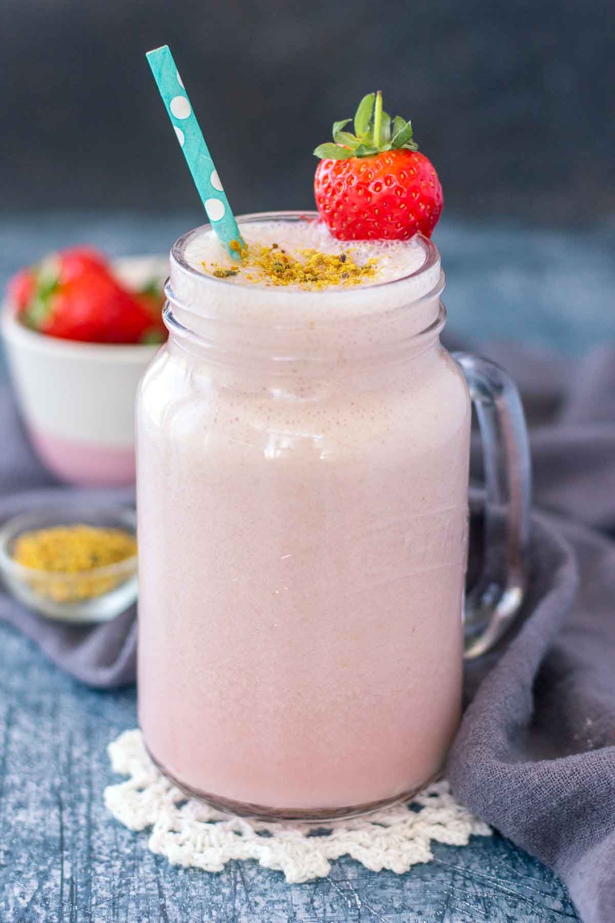 Strawberry Milk served in a tall glass with a straw